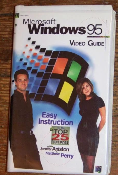 Guia de usuário em VHS do Windows 95, com Matthew Perry e Jennifer Aniston.